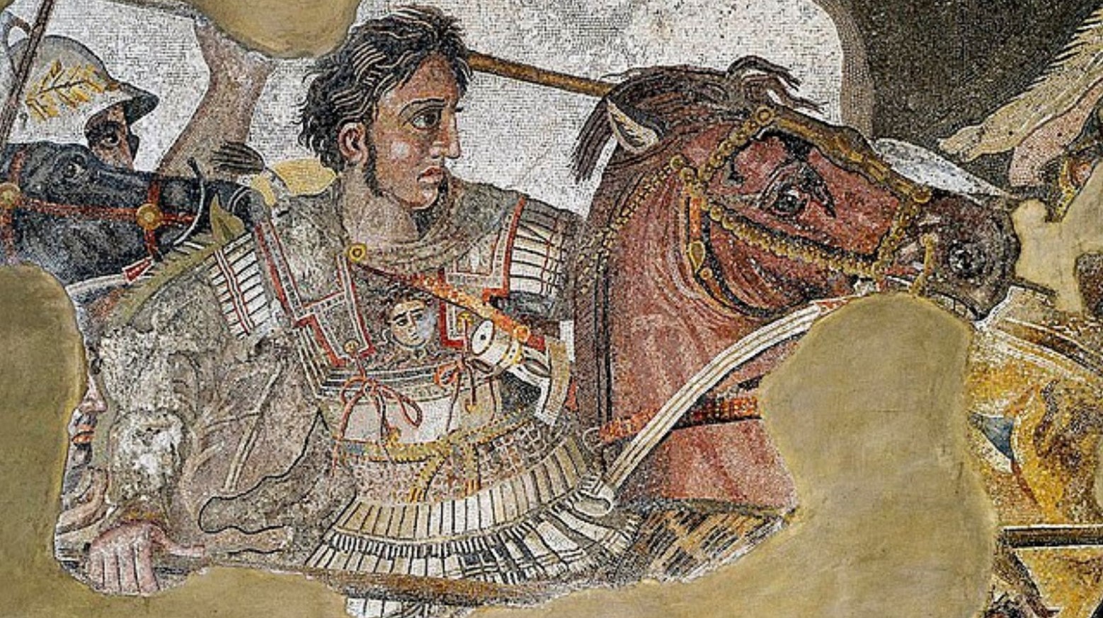 A mosaic of Alexander the Great. He is wearing armor and is riding a horse.