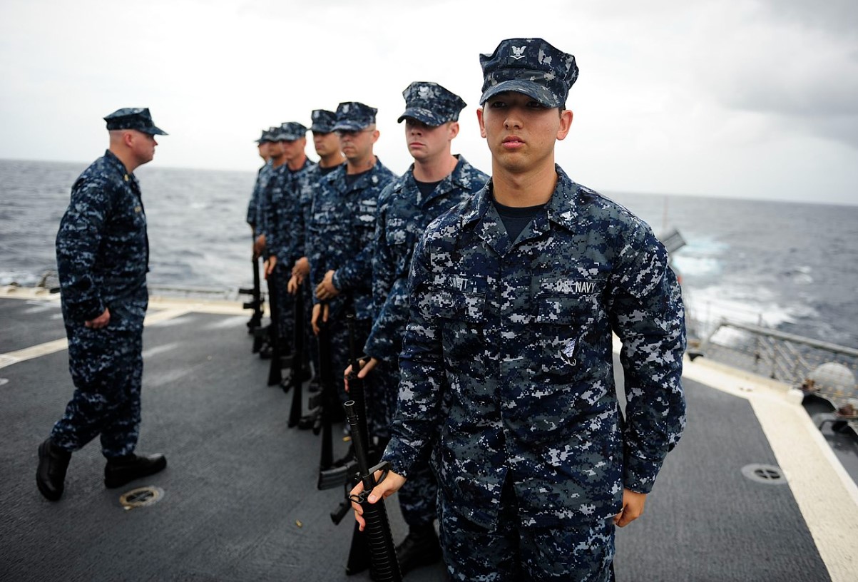 An image of several US Navy soldiers dressed in uniform