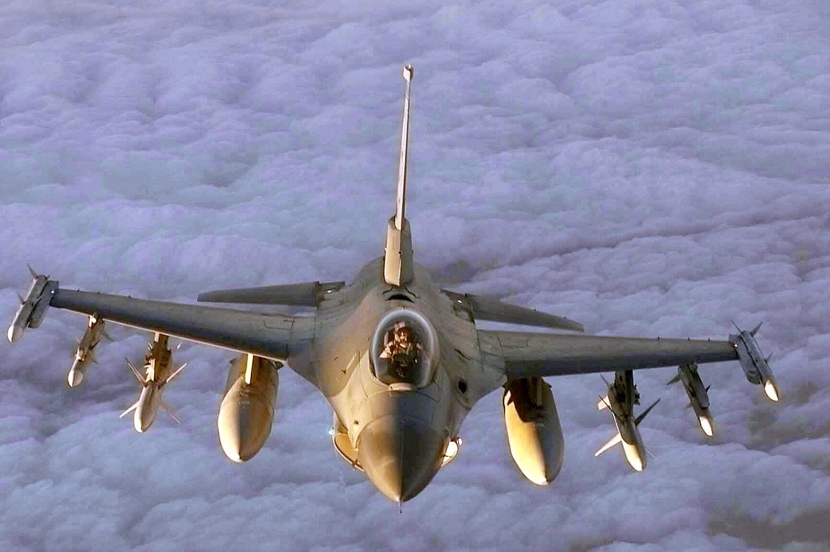An image of a US fighter jet flying through the clouds