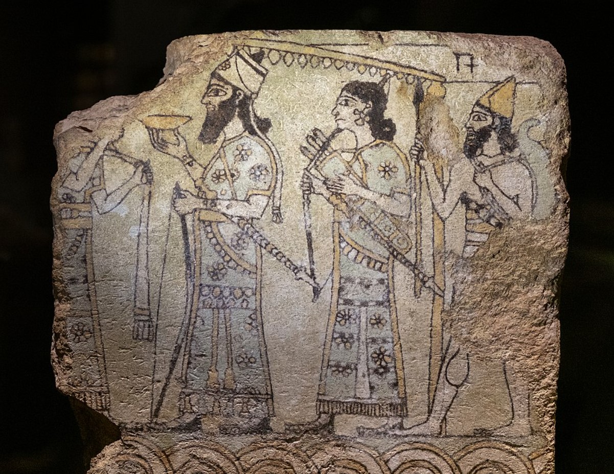 An image depicting an Assyrian king and several servants