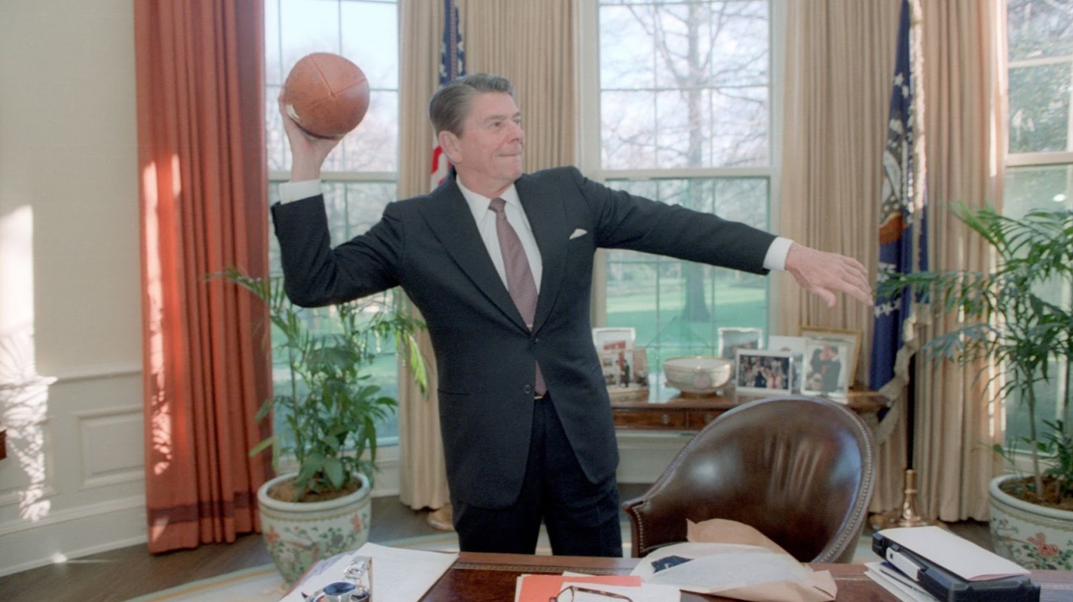 President Ronald Reagan throwing around a football in the Oval Office in 1982.