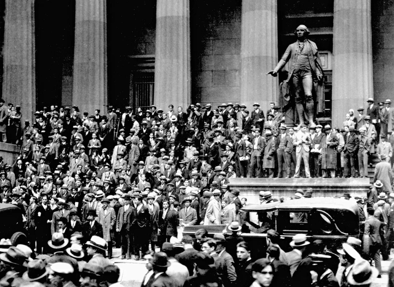 People gathering on the steps of the building across from the New York Stock Exchange on October 24, 1929