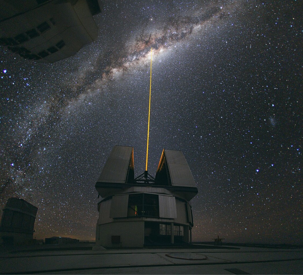 An image of The Paranal Observatory of European Southern Observatory shooting a laser guide star to the Galactic Center