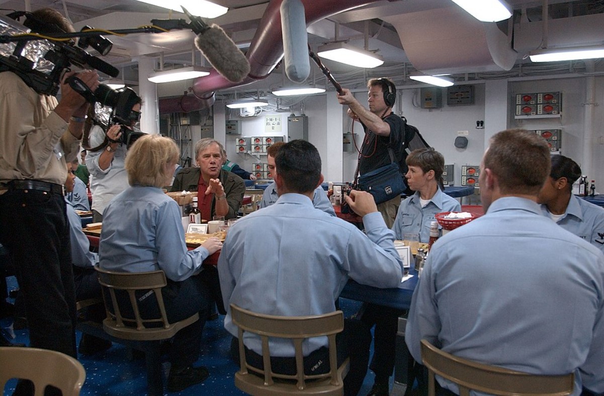 Several sailors are interviewed as they eat underneath the deck of the ship