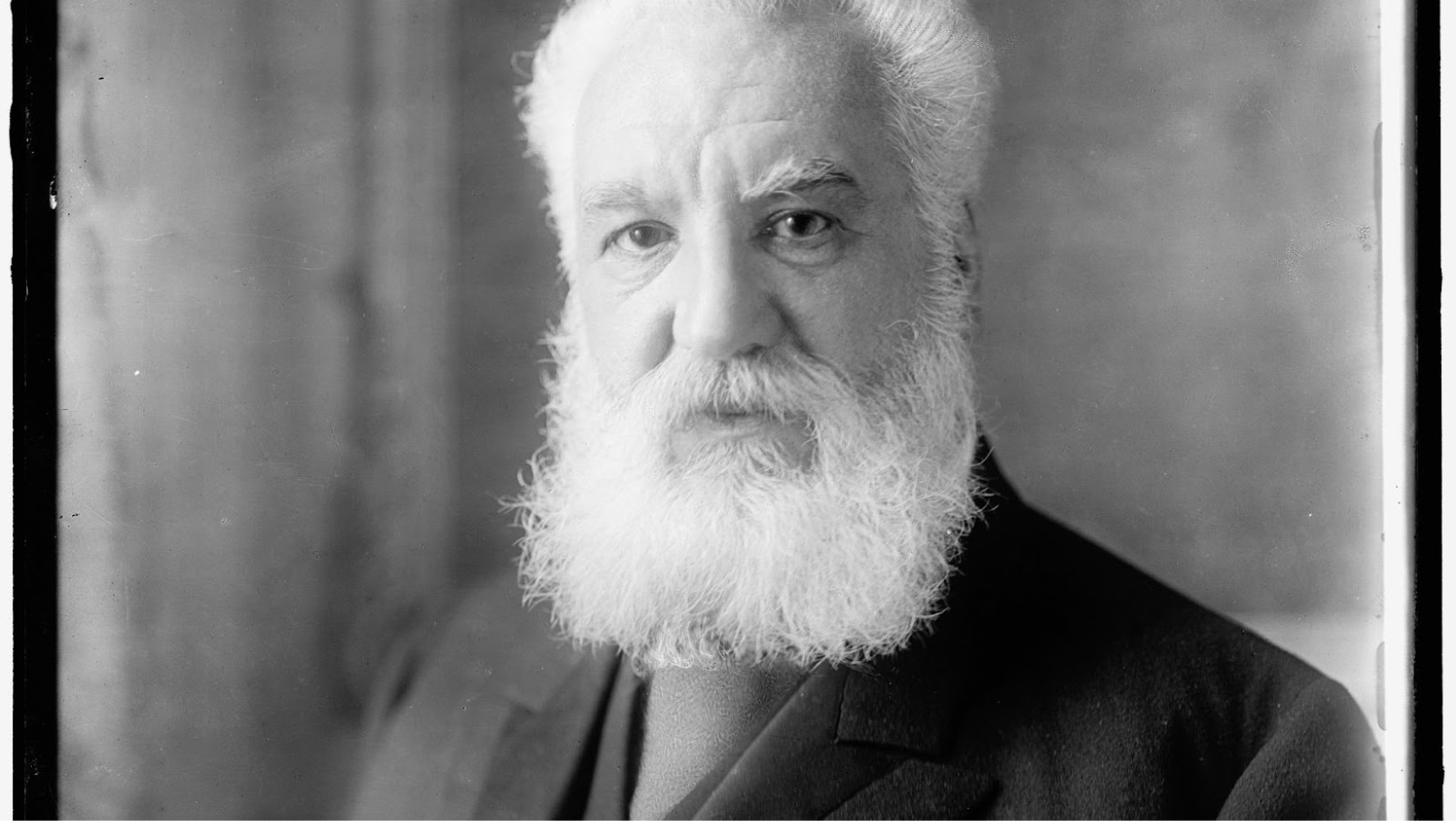 A 1900s black and white photograph of Alexander Graham Bell.
