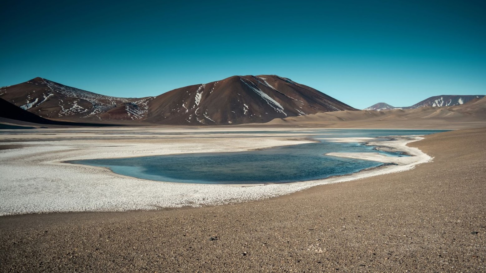 A lagoon and mountains seen in Atacama, Chile.