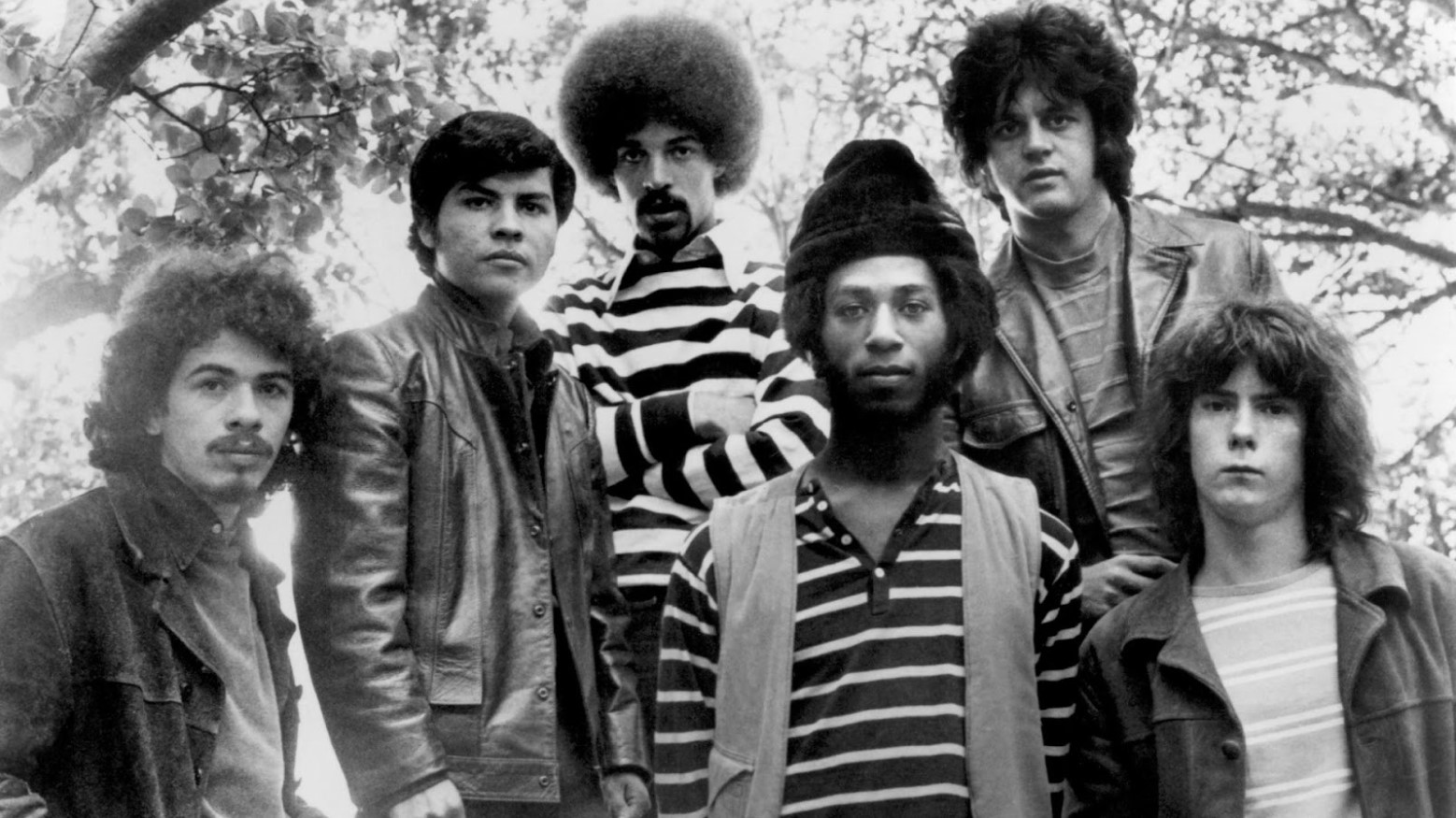 A black and white photo of the band Santana from 1969.