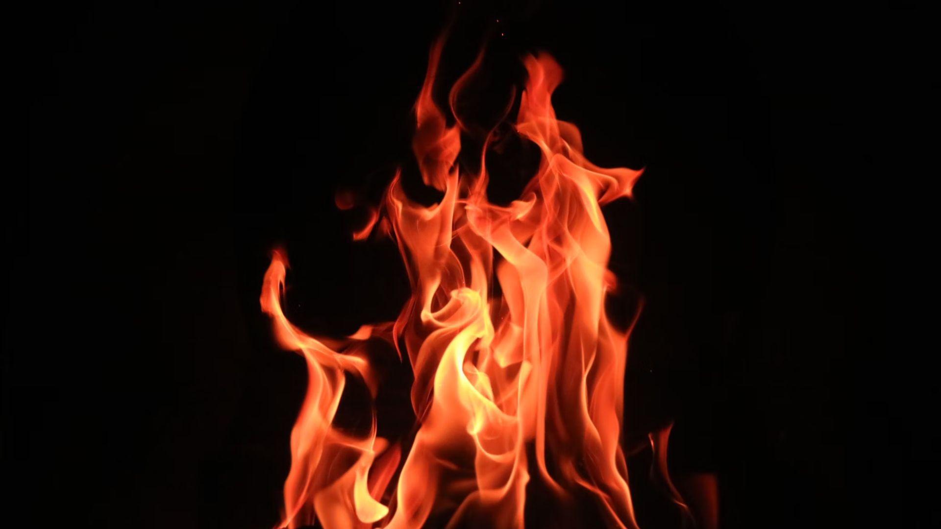 A fire against a black background.