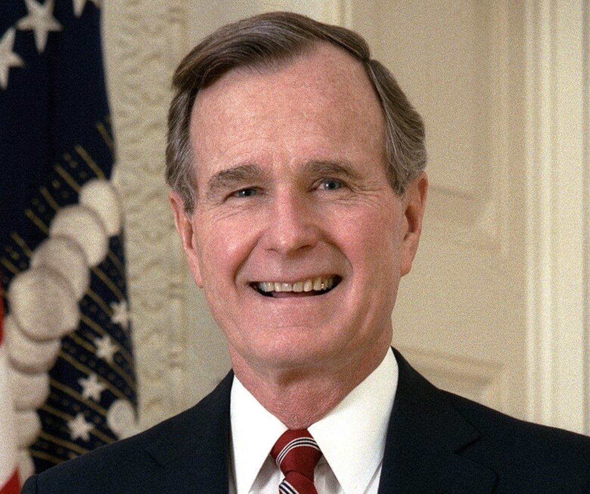 Portrait of George H.W. Bush in a navy suit
