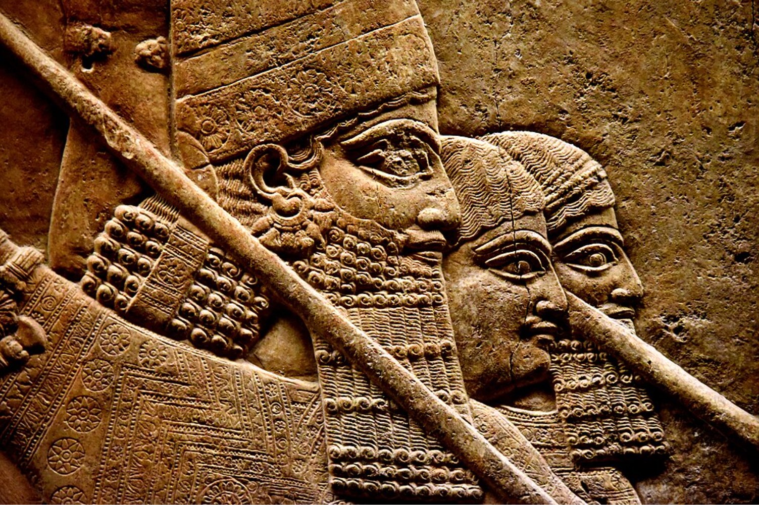 A carving that depicts the Assyrian king Ashurbanipal and two attendants