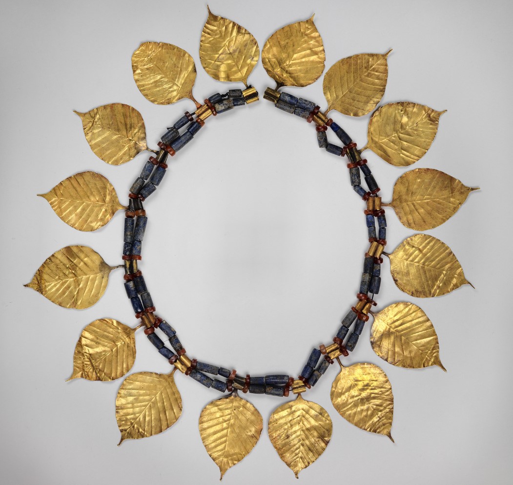 An image of a rare necklace comprised of small golden leaves discovered in Ur
