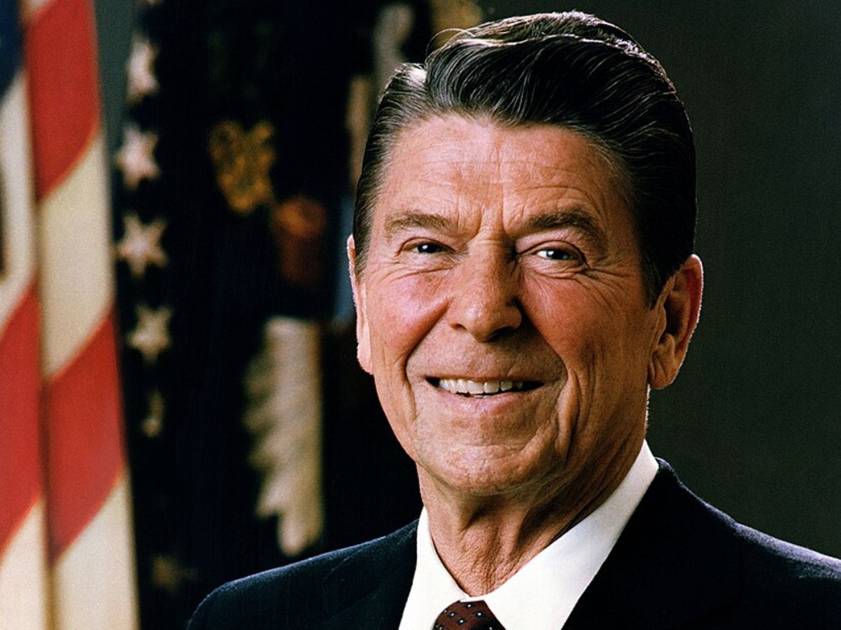 An image of Ronald Reagan smiling in the White House