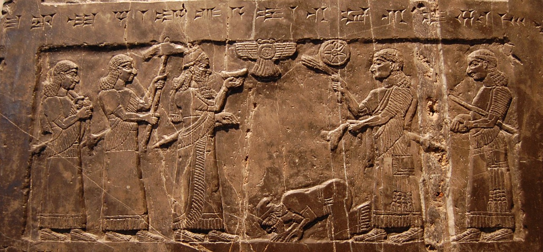 A relief carving depicting the Assyrian kings receiving tribute from a rival kingdom