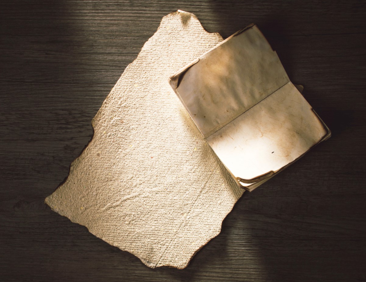 An old paper notepad is pictured sitting on a table
