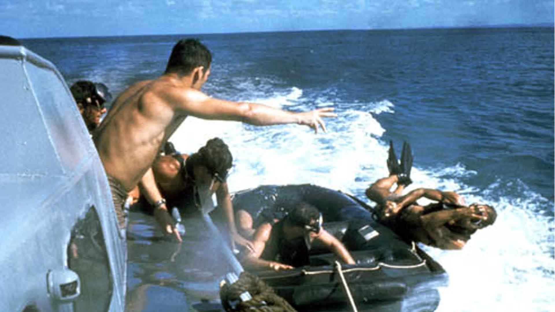 UDT members using the casting technique from a speeding boat
