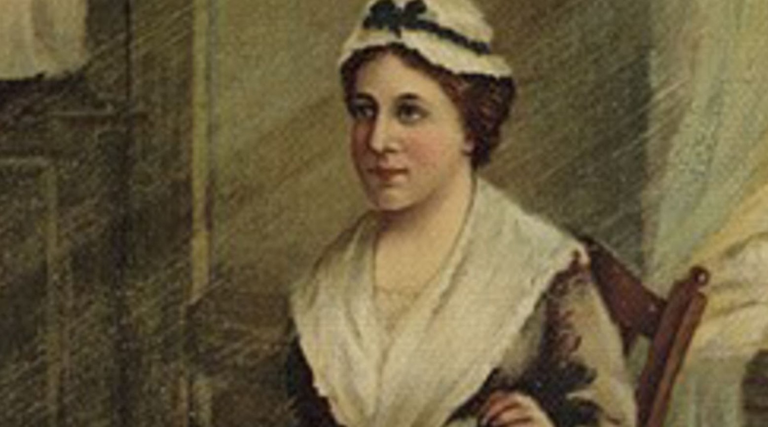 A painting of Betsy Ross. She is sitting in a wooden chair and is wearing a white hat with a ribbon.