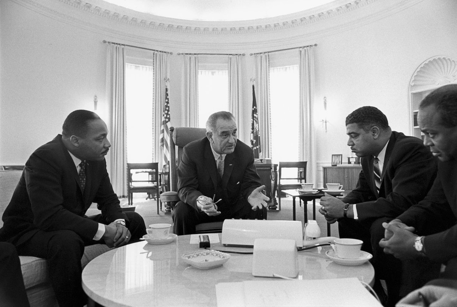 An image of Lyndon B. Johnson pictured alongside several civil rights leaders