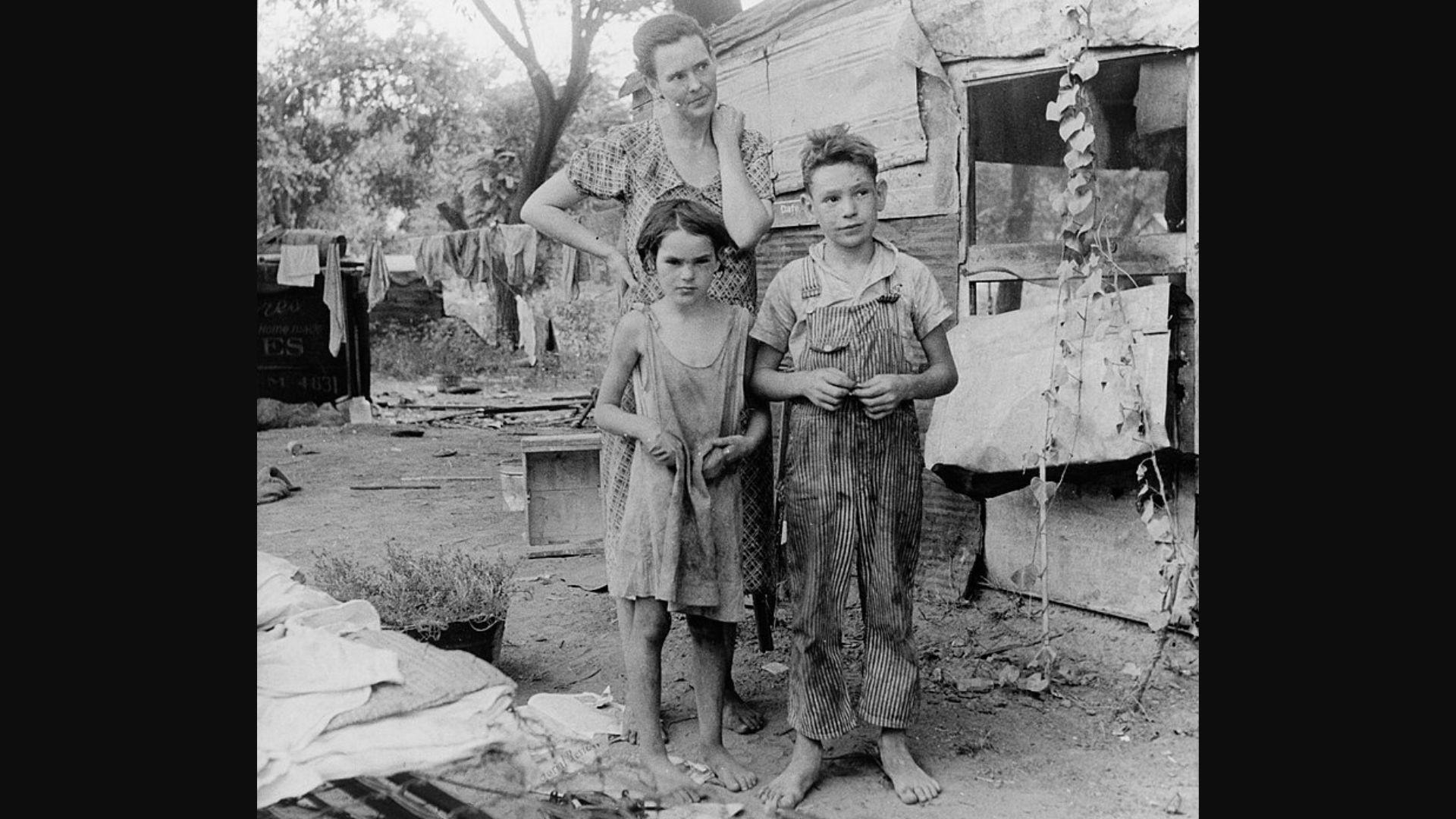 An impoverished American family living in a shanty in 1936