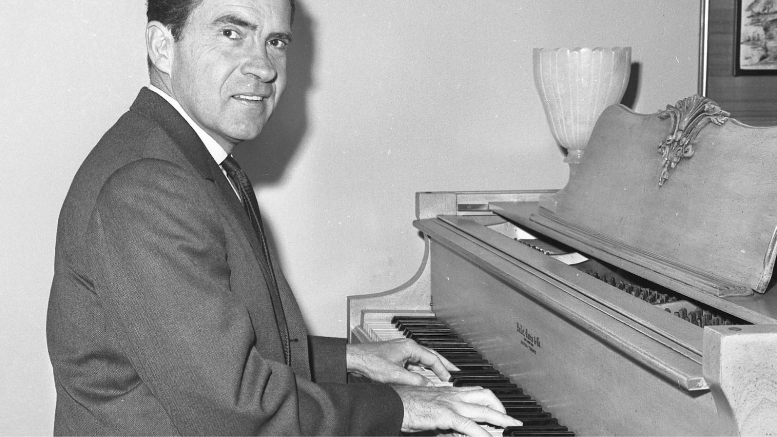 Richard Nixon in 1962 playing a piano.