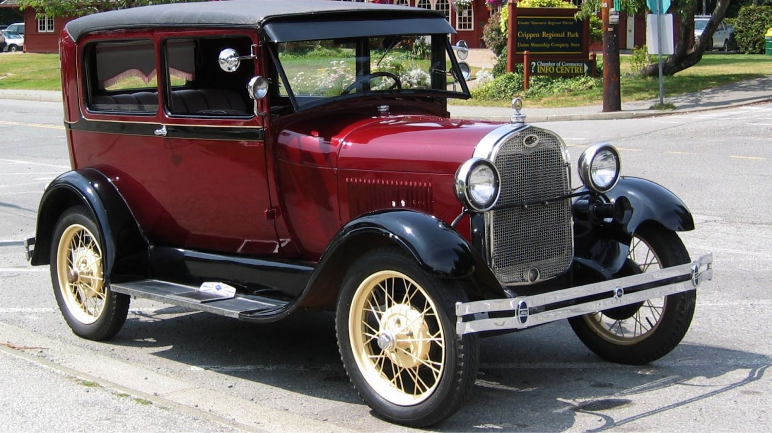 A 1920s Ford automobile seen in the daytime.