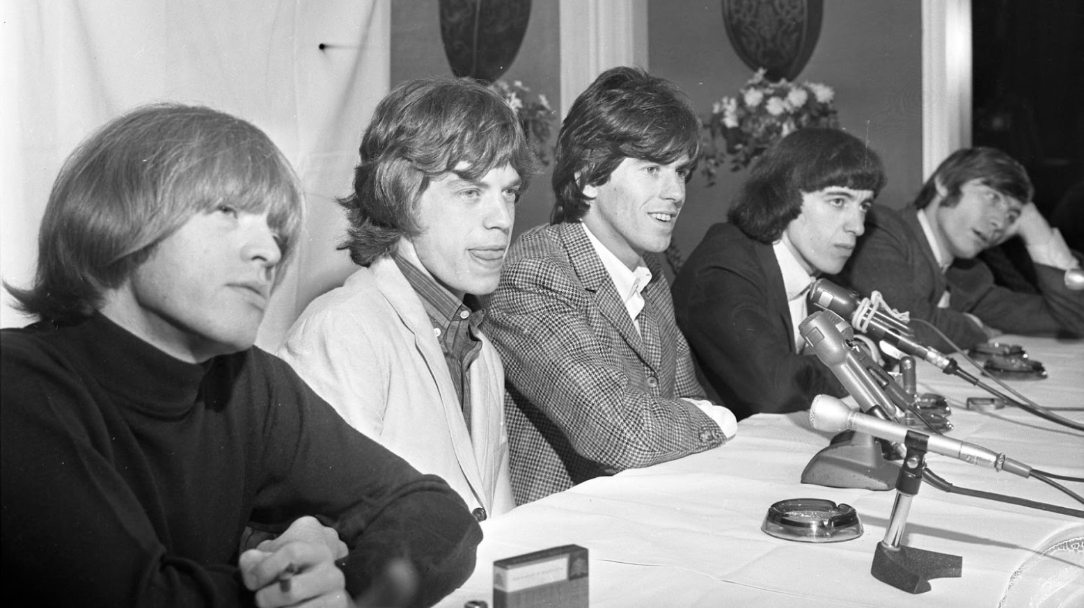 The Rolling Stones seen in a black and white photo from 1965.