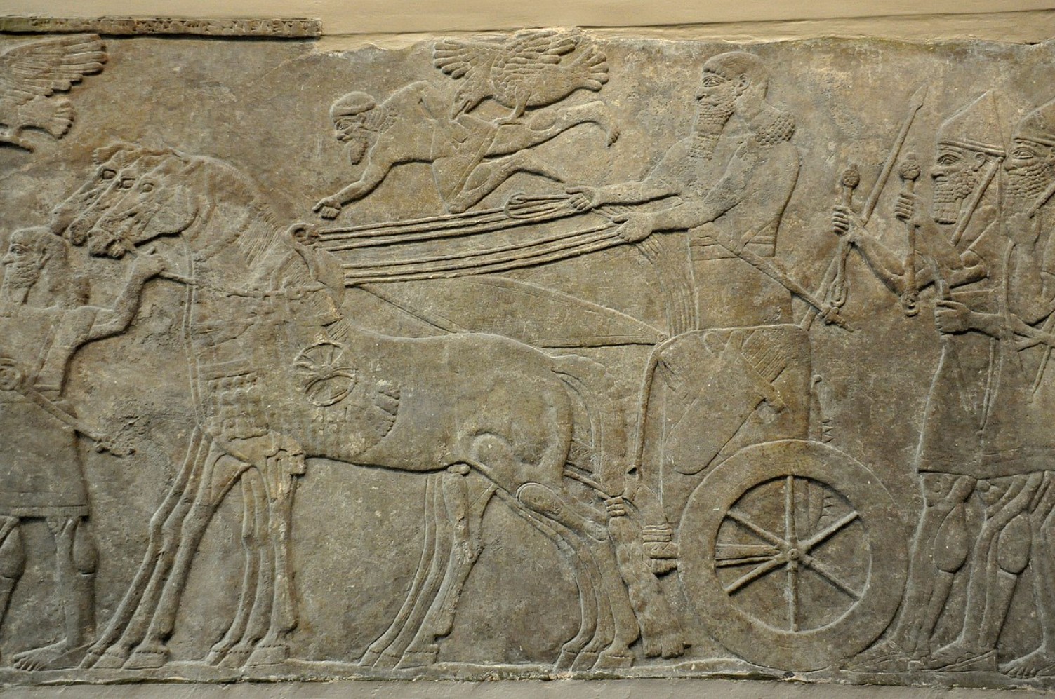 An image depicting several Assyrian soldiers riding on horses during war