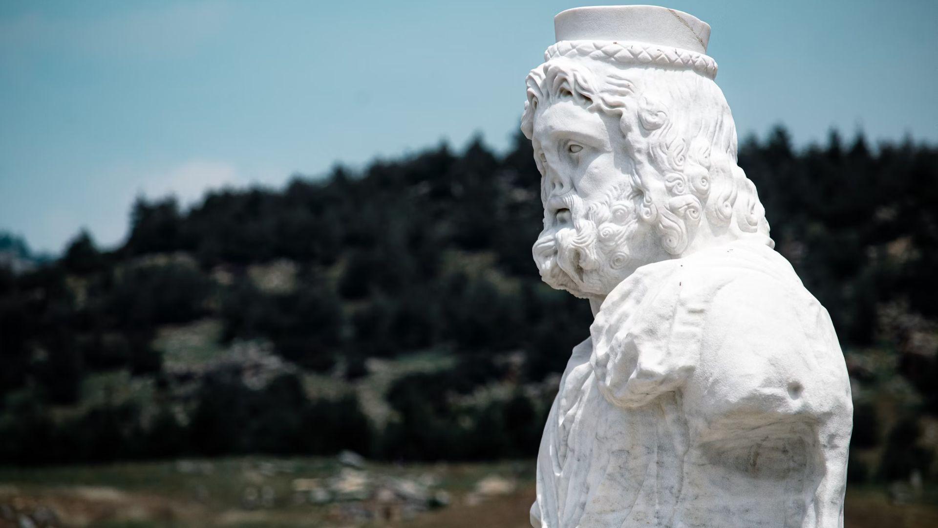 A white statue of Hades.