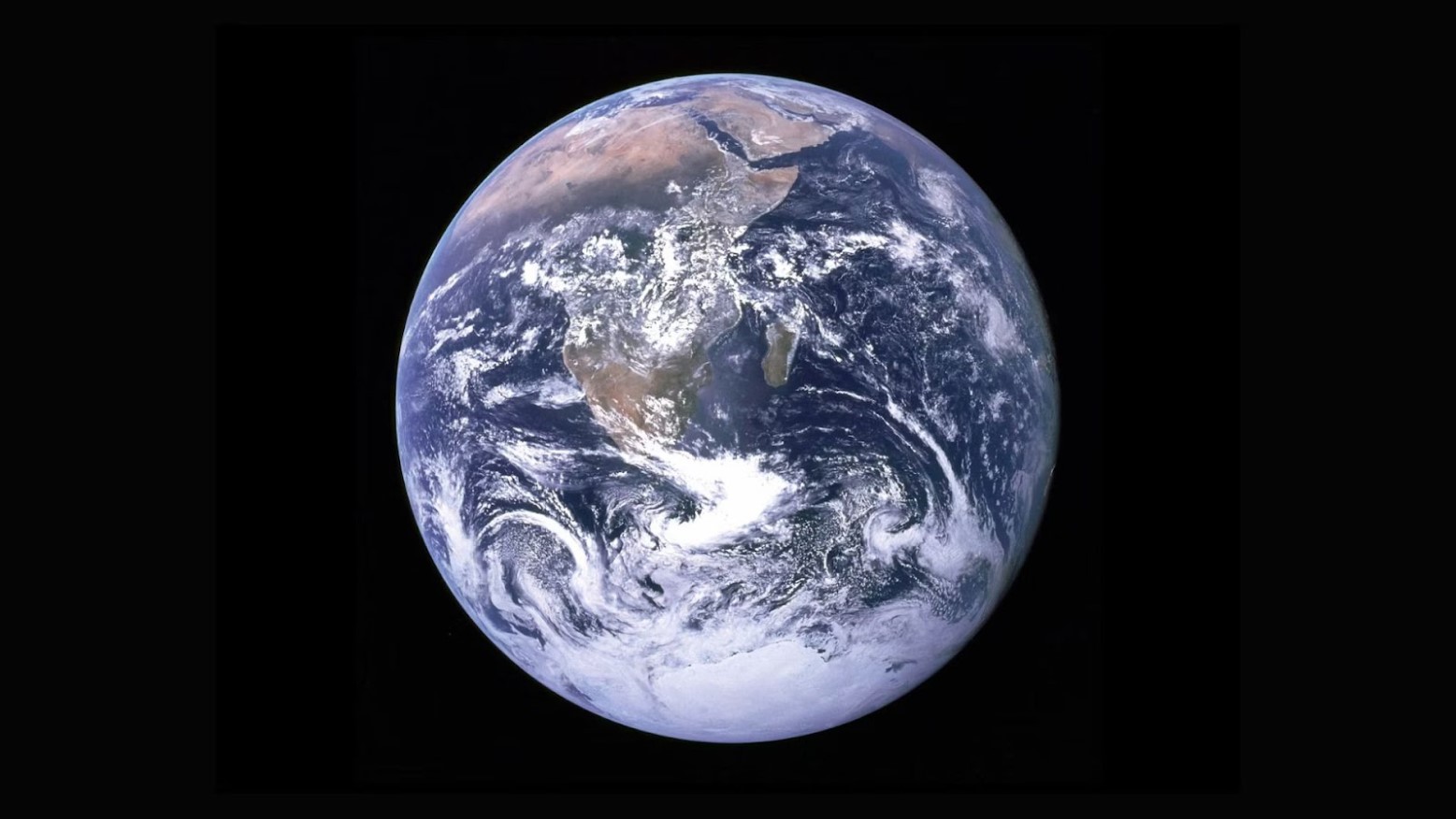 An image of Earth from space. There are a lot of clouds in the southern hemisphere.