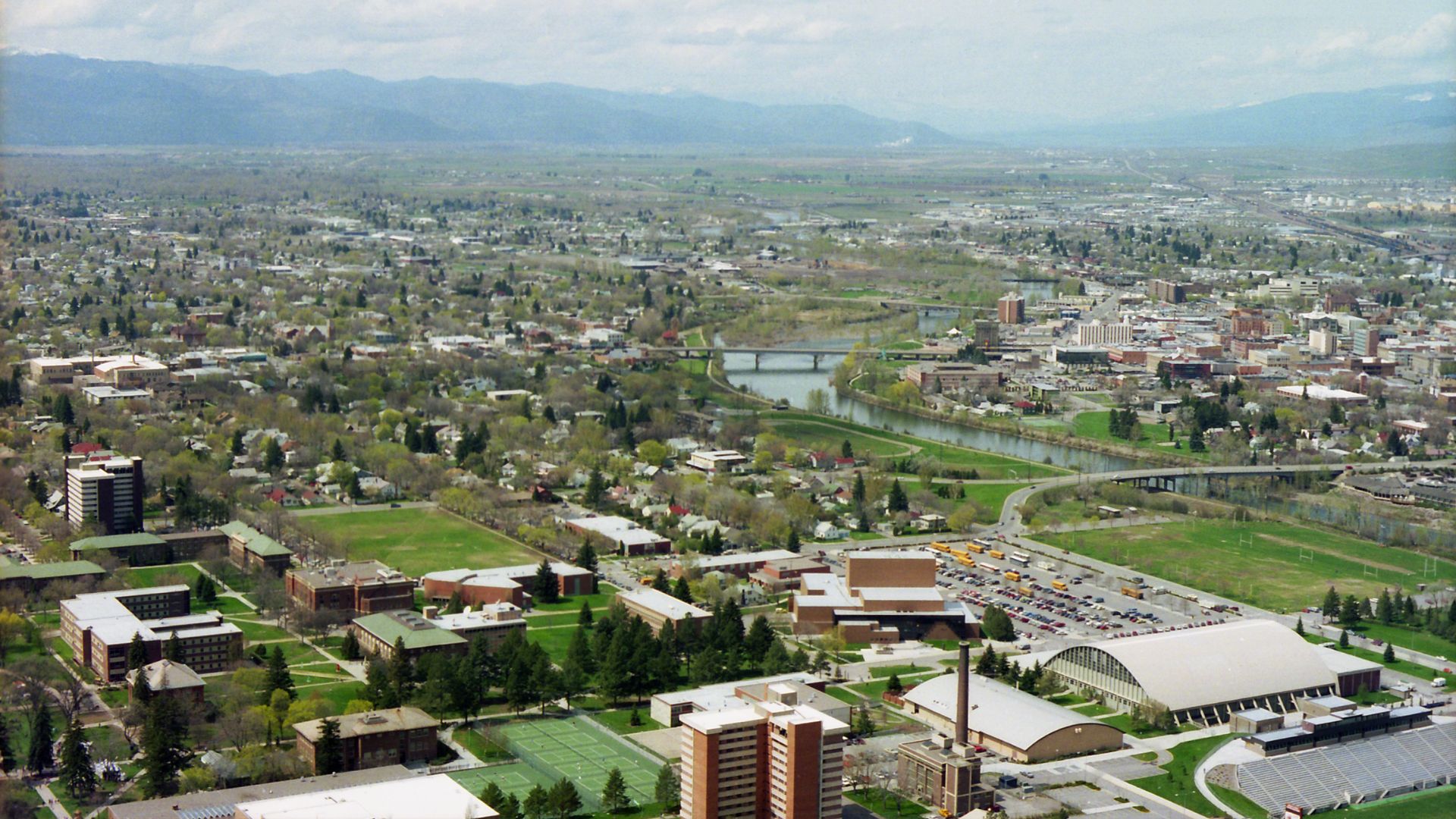 An aerial view of the Missoula, Montana skyline seen in the daytime.