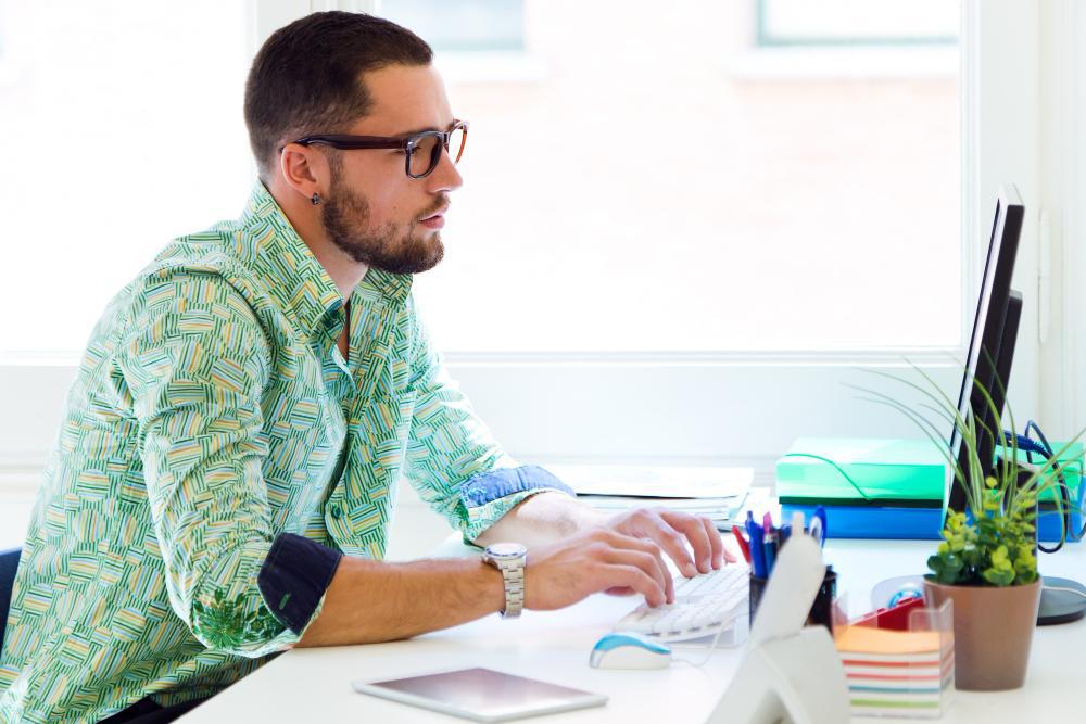 An analyst is pictured working from his desk