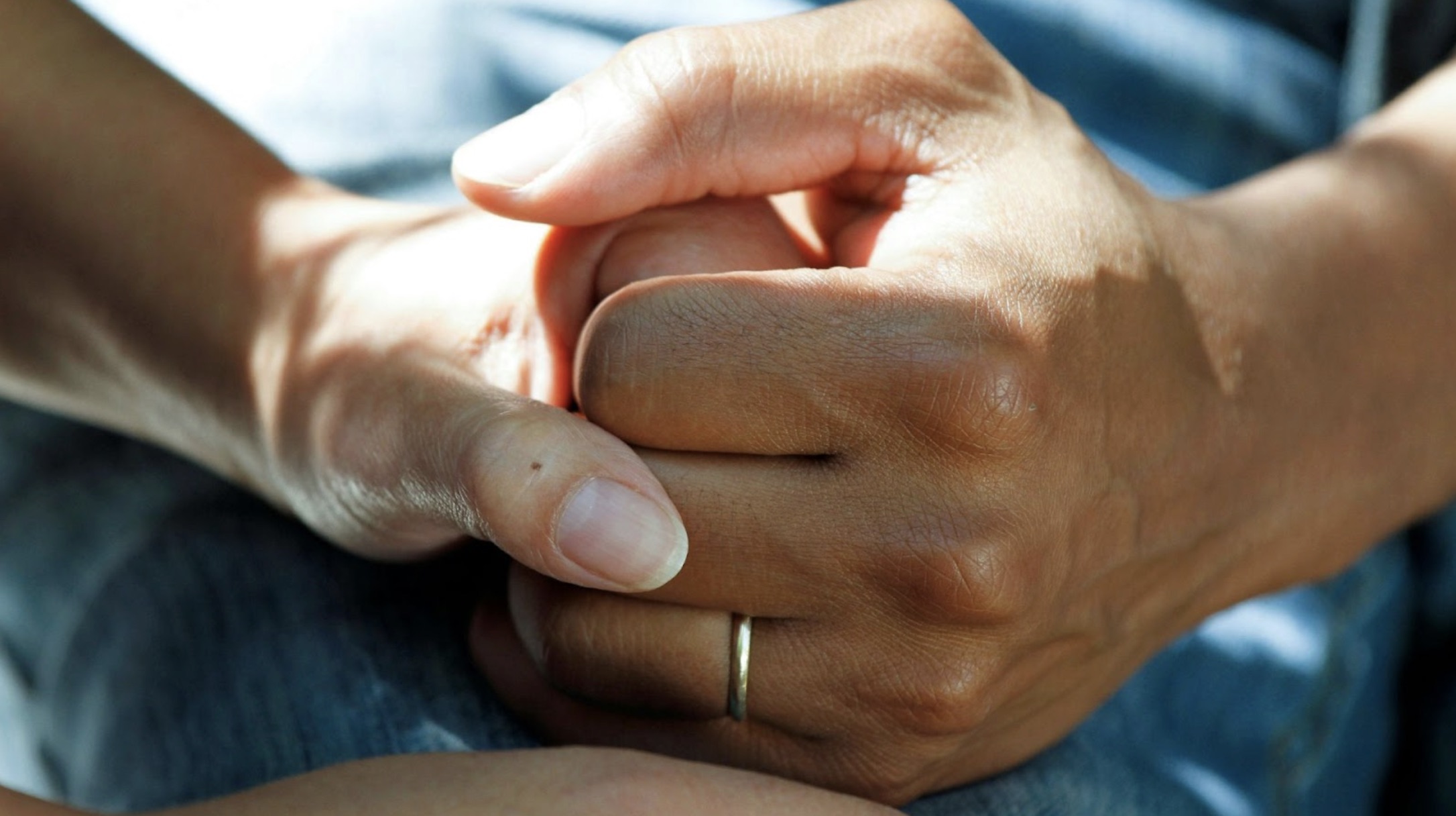 A person holding another person’s hand.