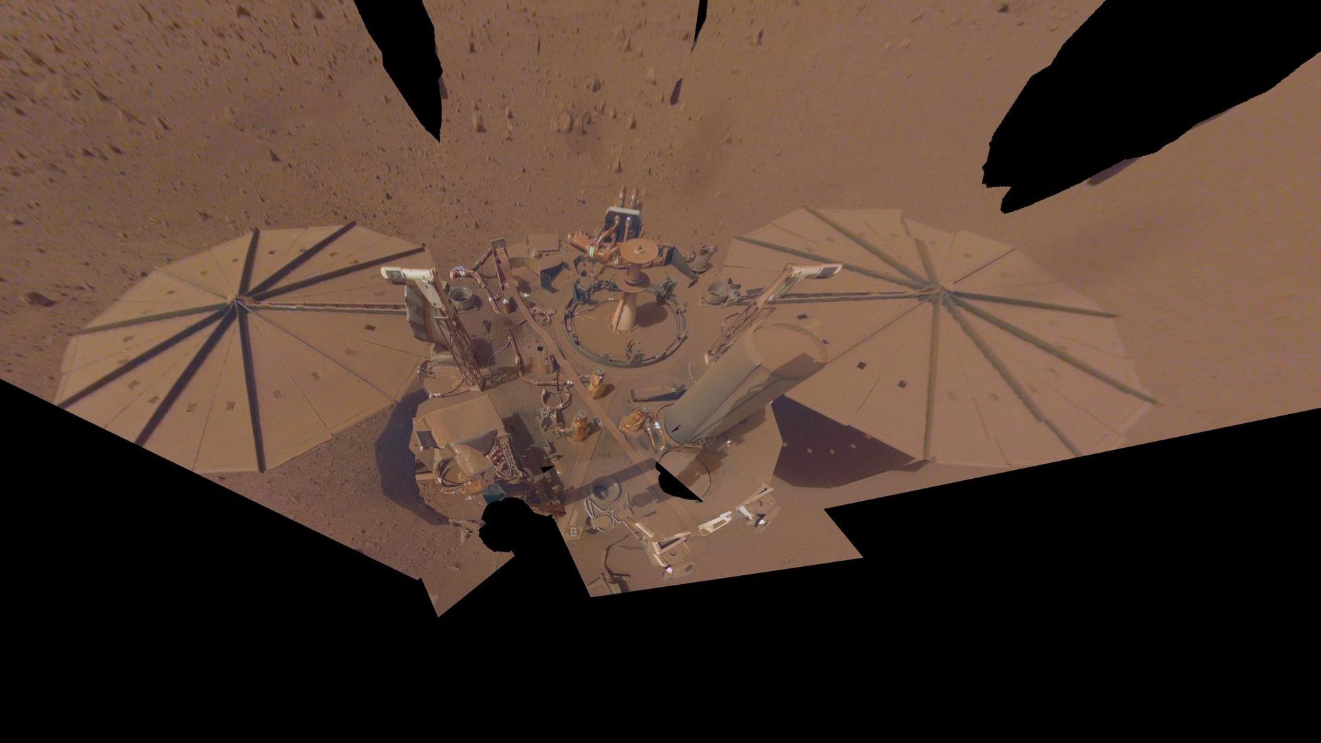 The InSight lander’s last dusty selfie taken before it became defunct and ran out of batteries.