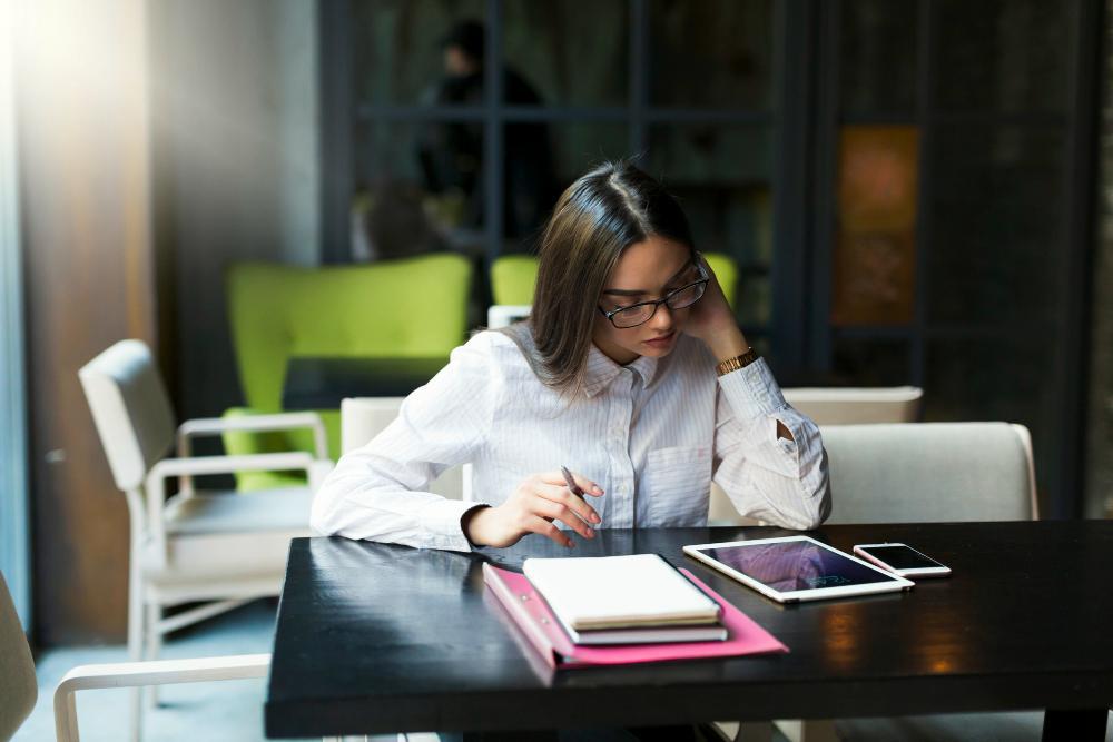 A female researcher is pictured seated at her desk