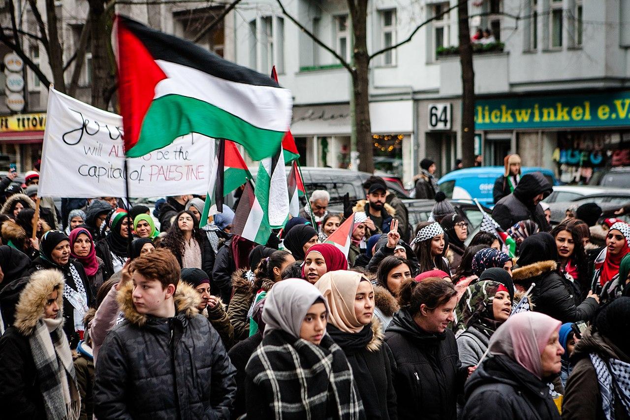 A photograph of people on the streets in protest of Palestine