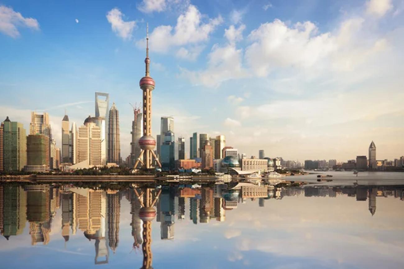View of Pudong Shanghai, China, from the Bund River, with several high skyscrapers, including the Pearl Tower