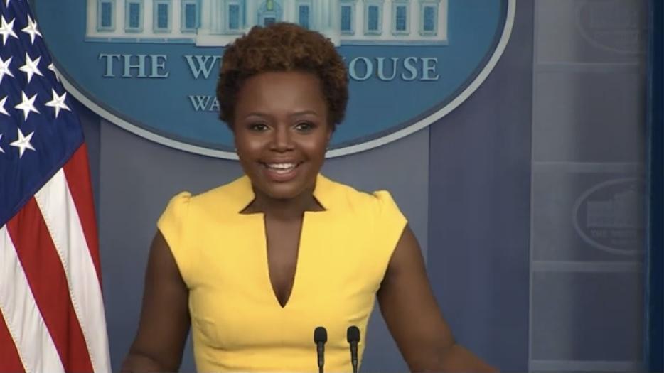 A photograph of Karine Jean-Pierre dressed in a yellow dress