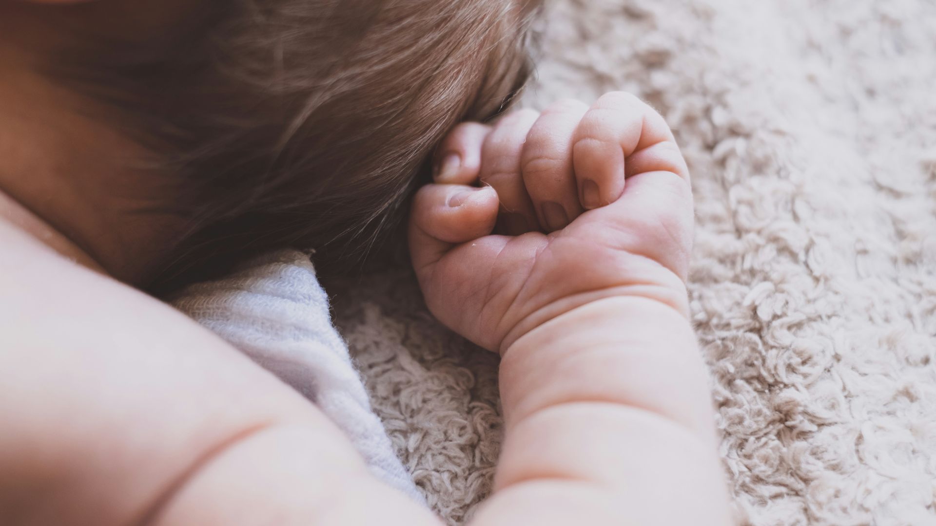 A close-up of a newborn baby’s hand.