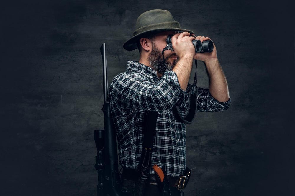 A hunter is pictured looking through his goggles