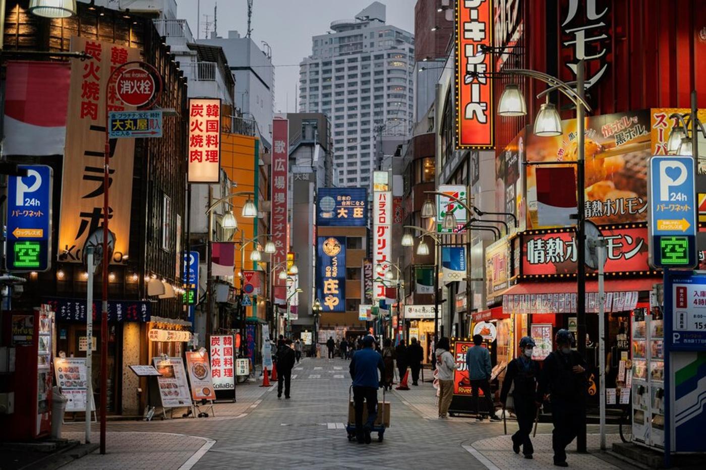 Cityscape in China with several restaurants, stores, and pedestrians