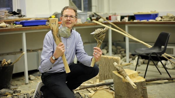 Larry Barham holding bones at the University of Liverpool