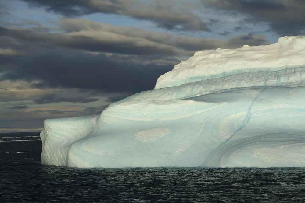 A photograph showcasing a melting ice cap in the North Pole