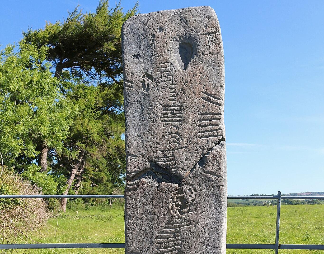 A photograph of a standing ogham stone in Ireland