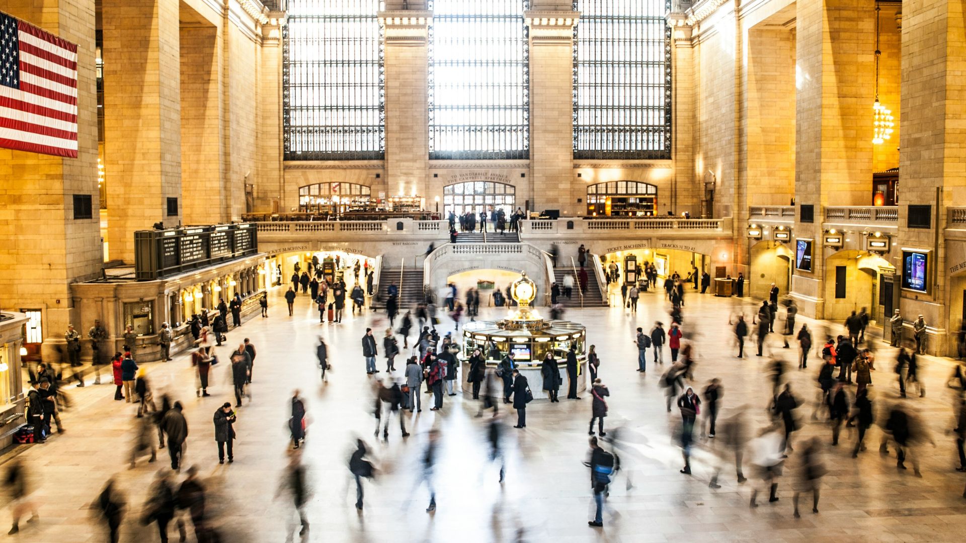 Many people walking around Grand Central Station.