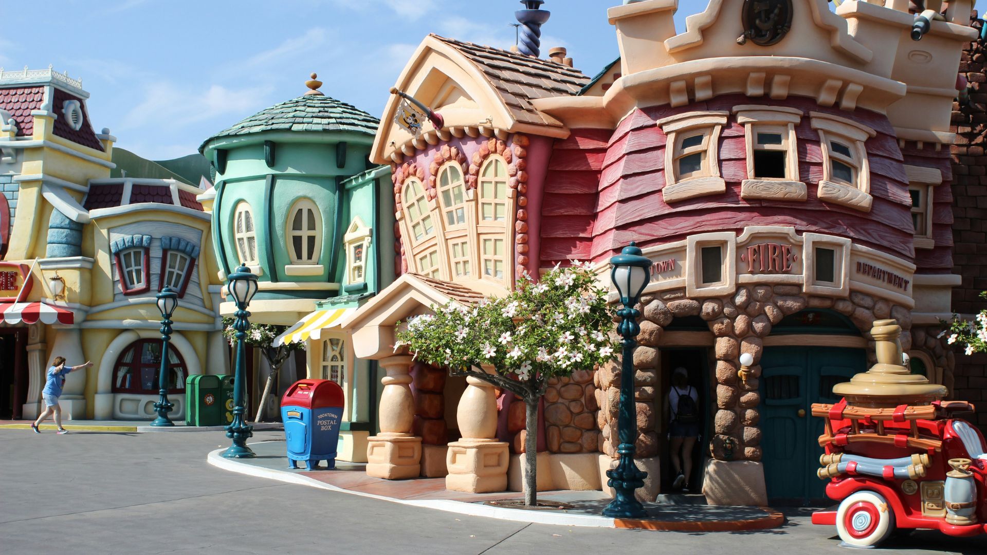 An immersive Disneyland theme park seen in the daytime.