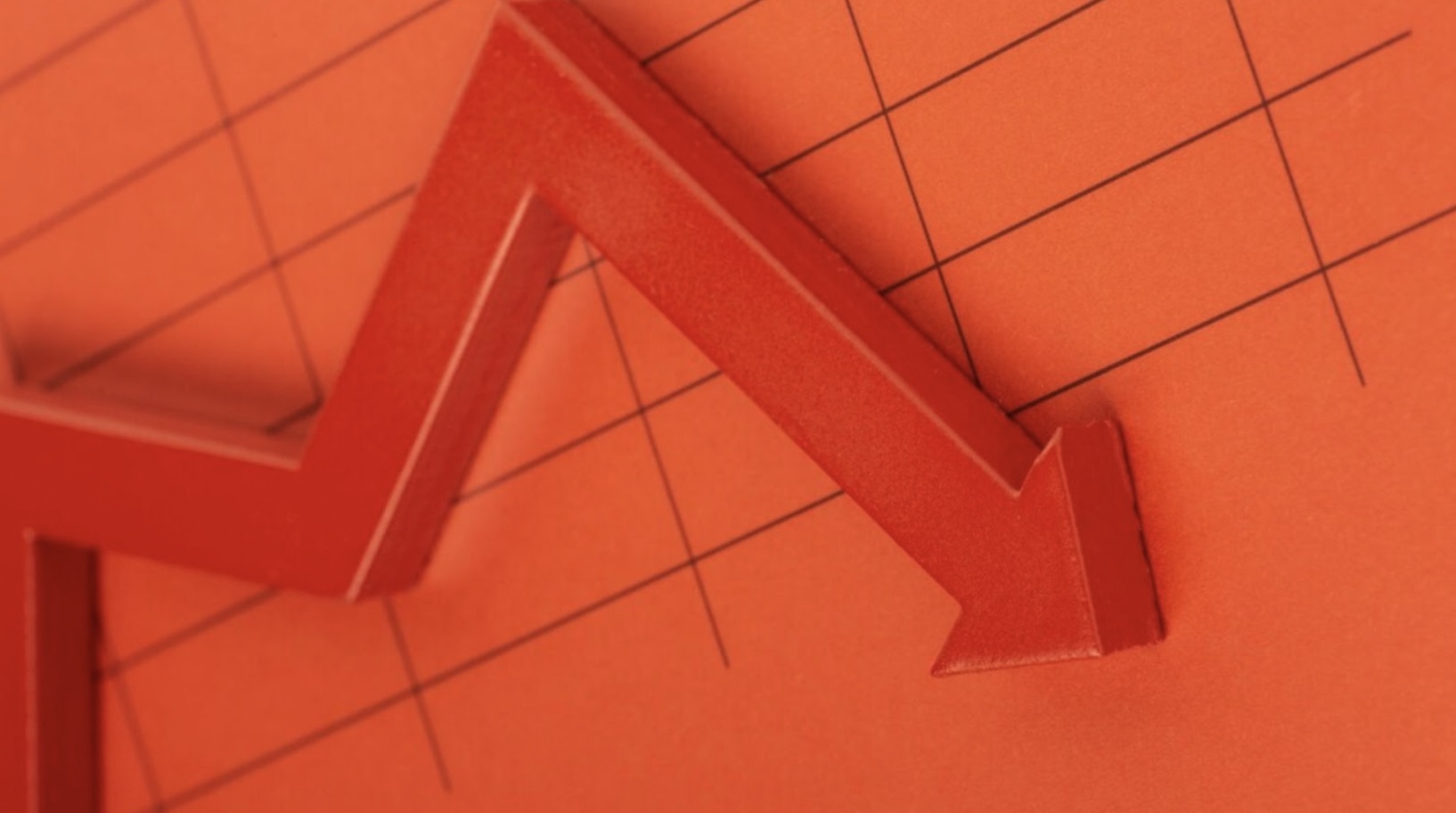 A red arrow on a chart going down.