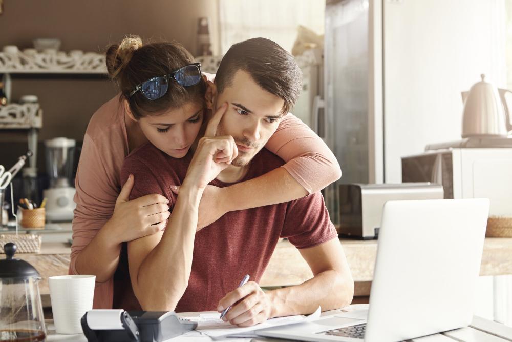 A photograph of a couple working on their finances