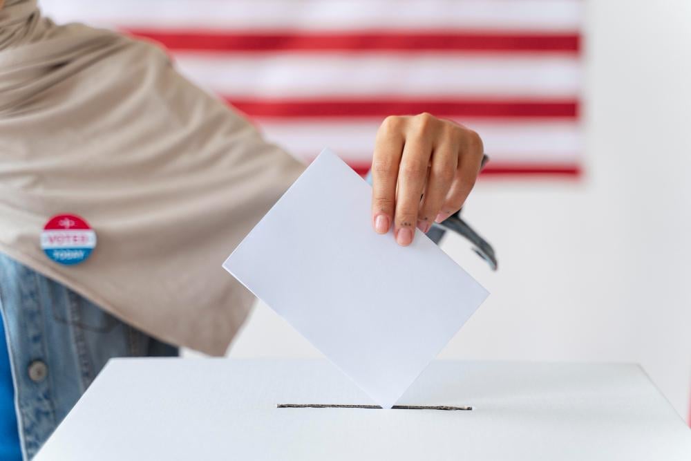 A woman is pictured voting