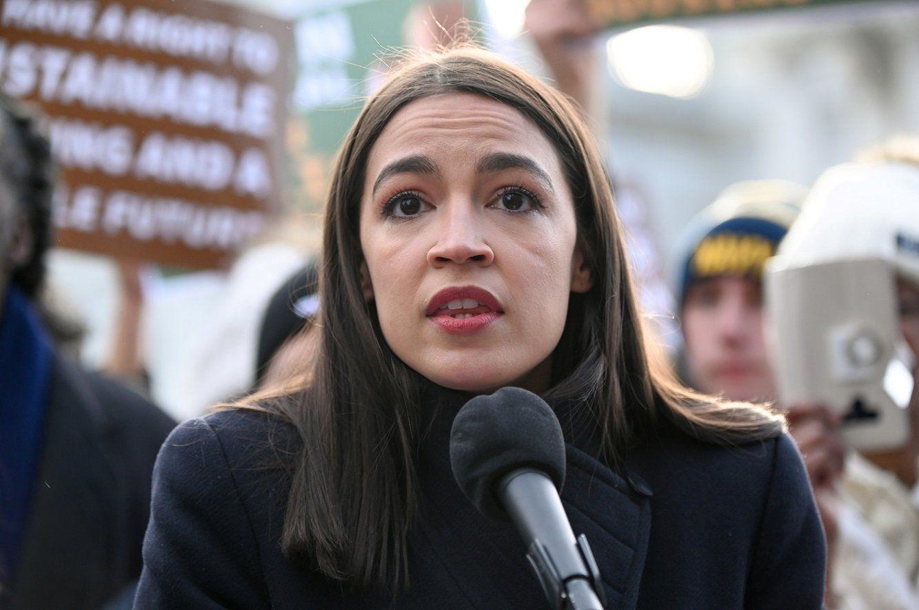 A photograph of AOC during a speech