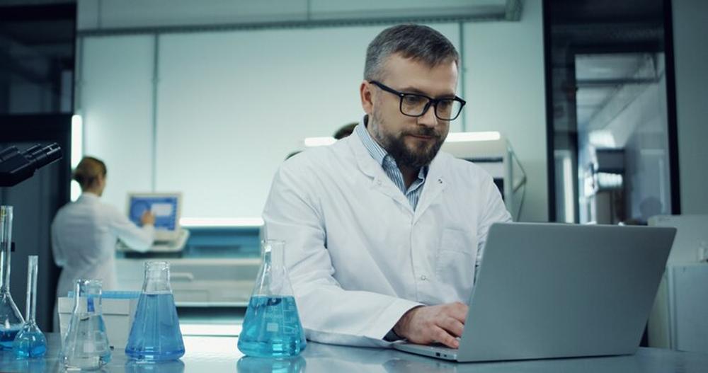 A photograph of a researcher at his desk
