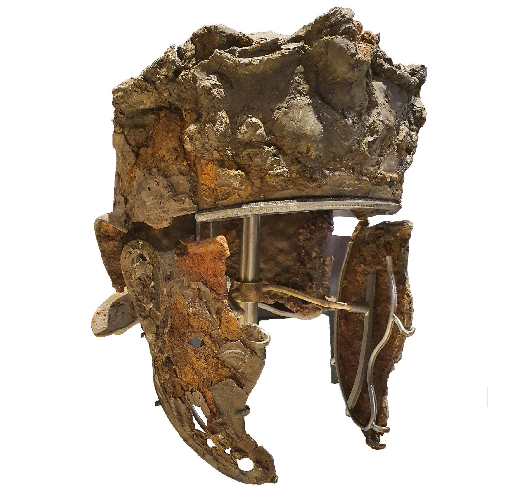 A photograph of the rusted Roman cavalry helmet